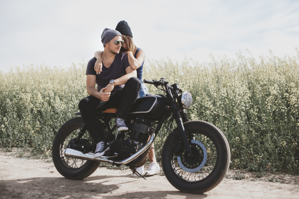 couple in field on motorcycle